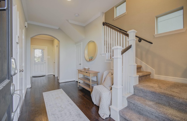 foyer featuring ornamental molding and dark wood-type flooring