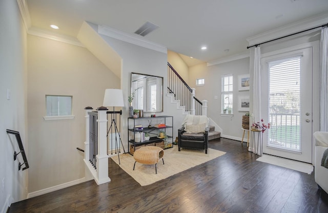 entryway featuring dark hardwood / wood-style floors, plenty of natural light, and crown molding