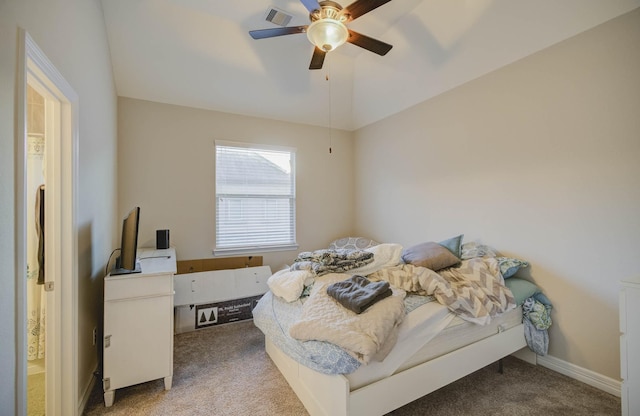 carpeted bedroom with ceiling fan and lofted ceiling