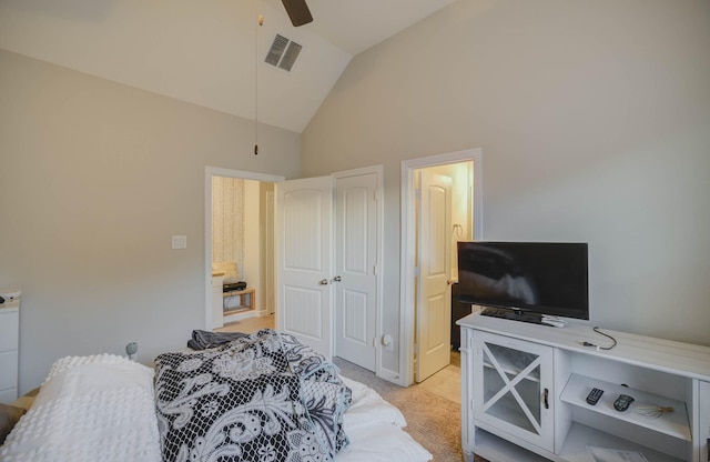 bedroom featuring a closet, light colored carpet, ceiling fan, and lofted ceiling