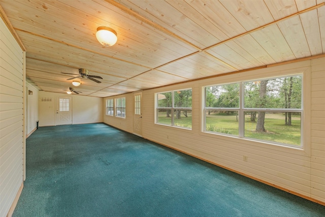 unfurnished sunroom with ceiling fan and wooden ceiling