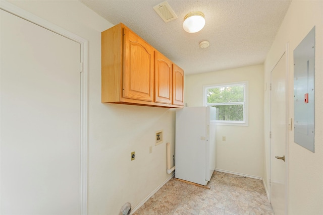 laundry room with electric dryer hookup, electric panel, hookup for a washing machine, and a textured ceiling