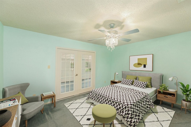 carpeted bedroom with french doors, a textured ceiling, and ceiling fan