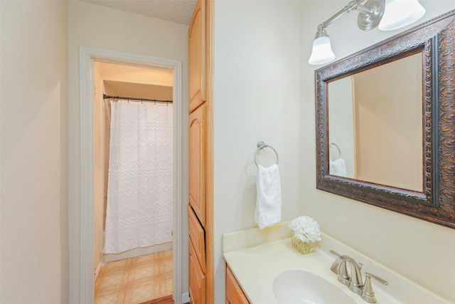 bathroom featuring vanity and a textured ceiling