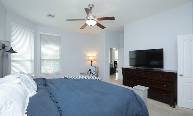 bedroom with light colored carpet and ceiling fan