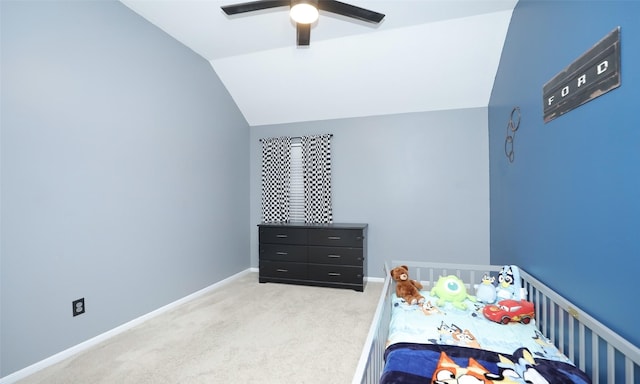 bedroom with lofted ceiling, light colored carpet, and ceiling fan