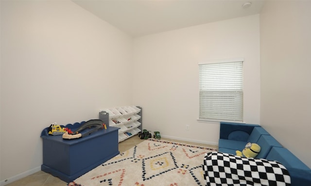 rec room with light tile patterned floors