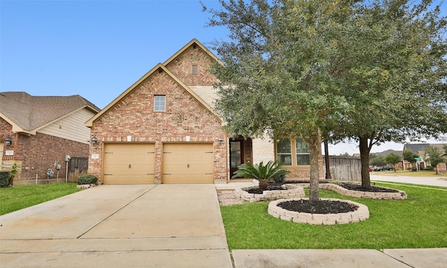 view of front of property with a front lawn and a garage