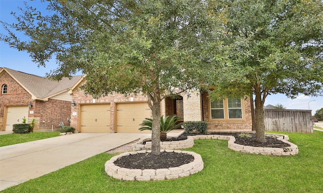 view of front of property featuring a garage and a front lawn