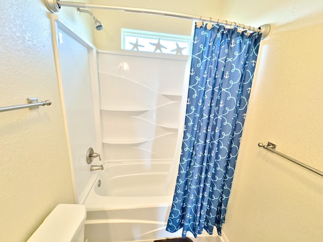 bathroom featuring shower / tub combo with curtain