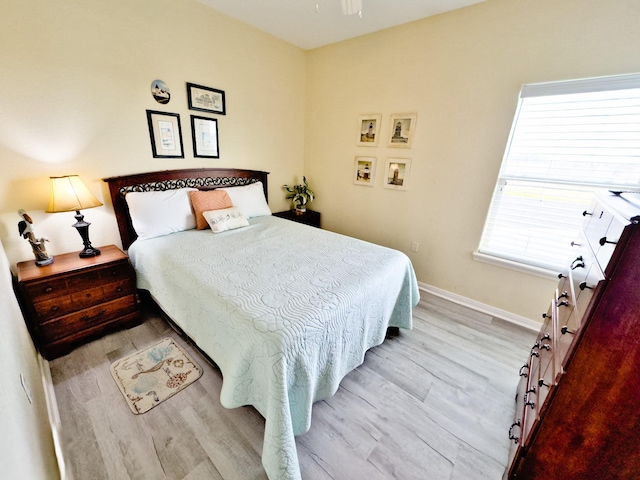 bedroom with light hardwood / wood-style floors