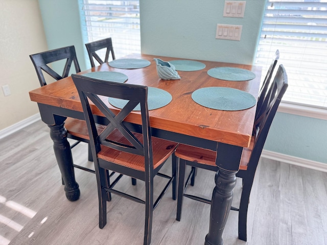 dining space featuring light hardwood / wood-style flooring