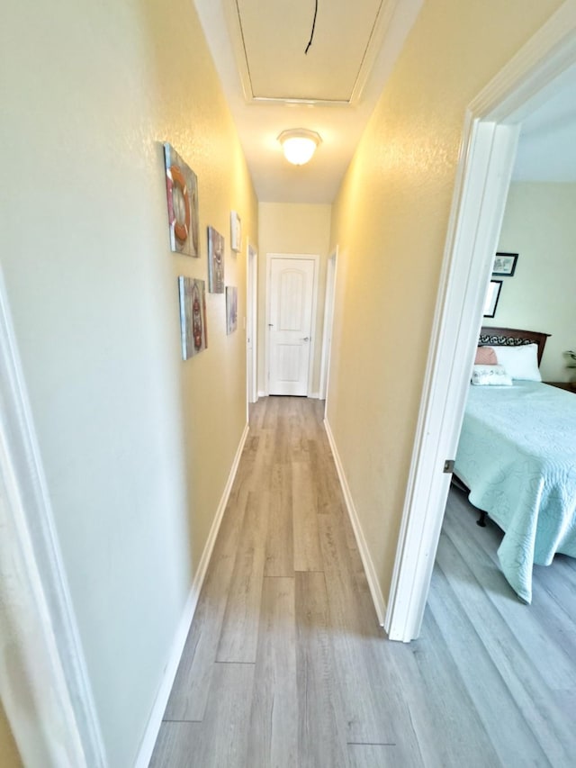 corridor featuring light wood-type flooring