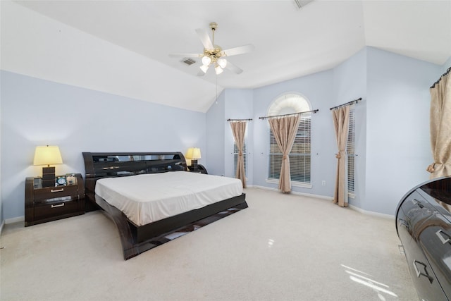 bedroom featuring ceiling fan, light colored carpet, and lofted ceiling