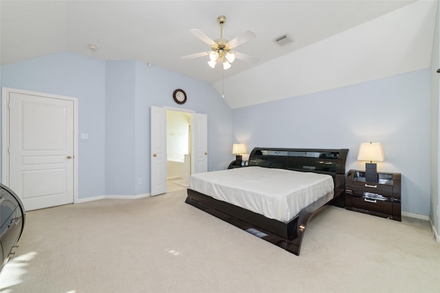 carpeted bedroom with lofted ceiling, ensuite bath, and ceiling fan