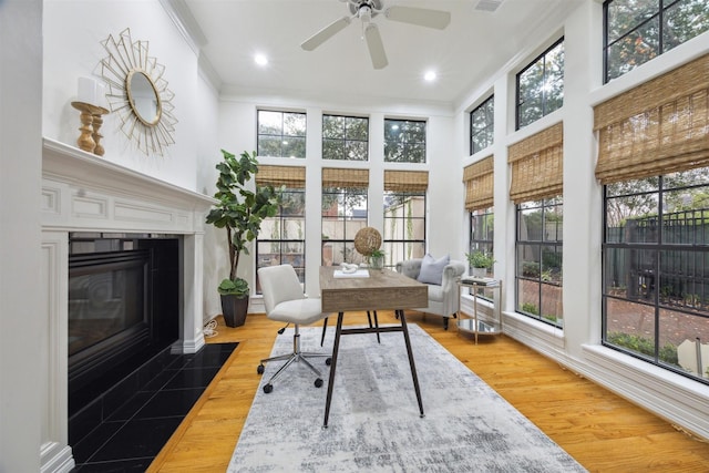 office with ceiling fan, hardwood / wood-style floors, and ornamental molding