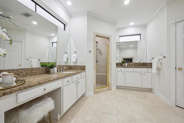 bathroom featuring ceiling fan, vanity, ornamental molding, and walk in shower