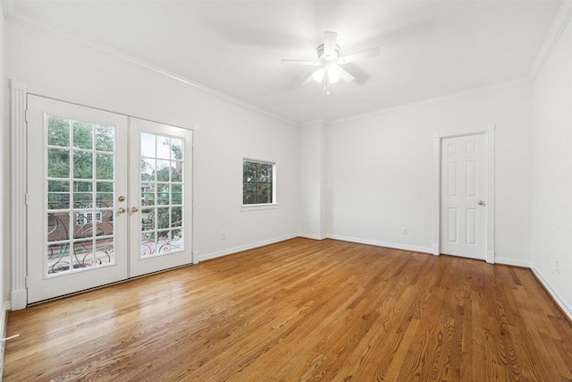 spare room with french doors, light wood-type flooring, ceiling fan, and ornamental molding