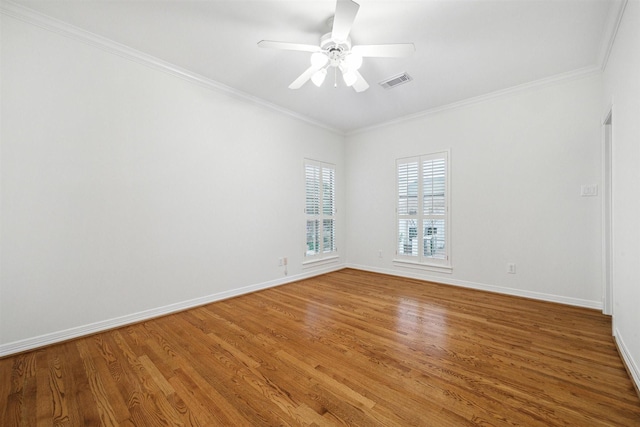 empty room with hardwood / wood-style flooring, ceiling fan, and ornamental molding