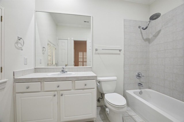 full bathroom with tile patterned floors, ornamental molding, vanity, toilet, and tiled shower / bath