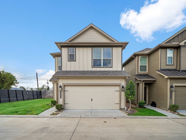 view of front facade with a front yard and a garage