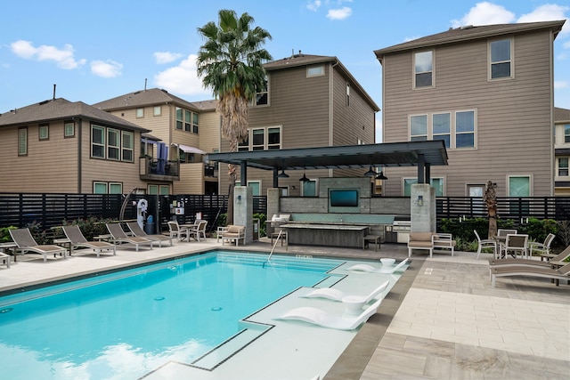 view of swimming pool with a patio