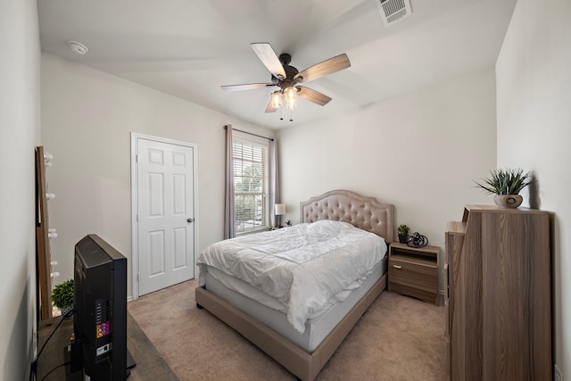 bedroom with light carpet and ceiling fan