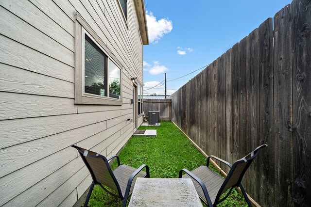 view of yard with central AC