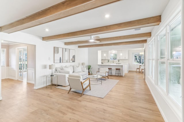 living room featuring plenty of natural light and light wood-type flooring