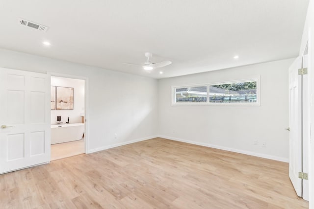 unfurnished bedroom with ceiling fan, light wood-type flooring, and connected bathroom