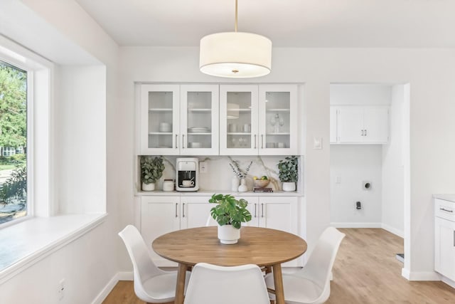 dining area with light hardwood / wood-style flooring