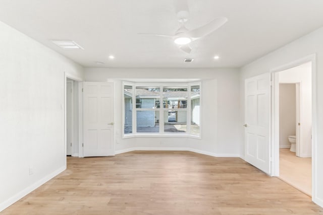 spare room with ceiling fan and light hardwood / wood-style flooring