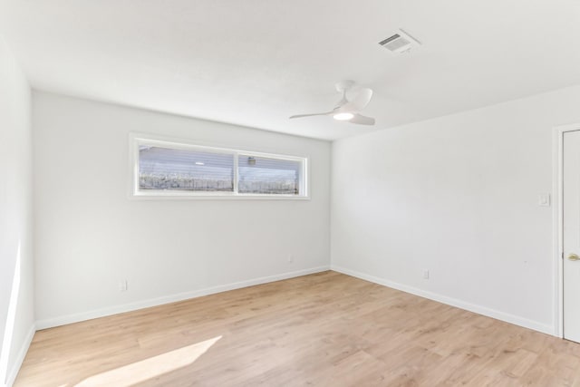 spare room with light hardwood / wood-style flooring and ceiling fan