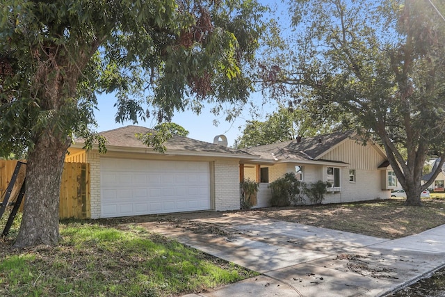 ranch-style home featuring a garage