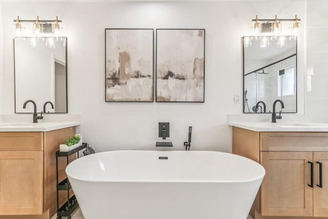 bathroom with a bath and vanity