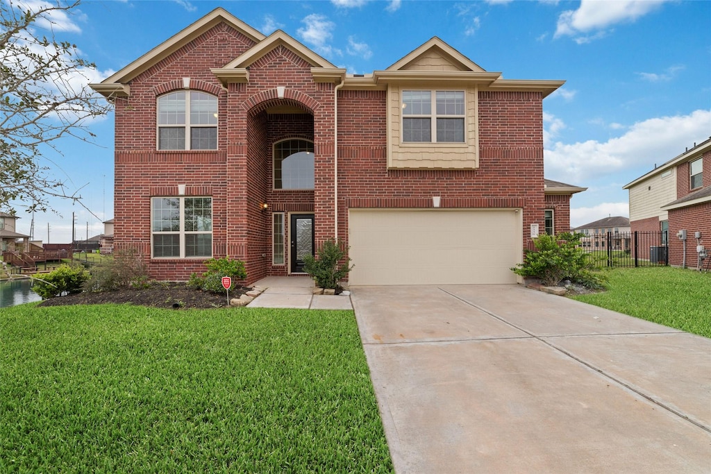 view of front property featuring a front yard and a garage