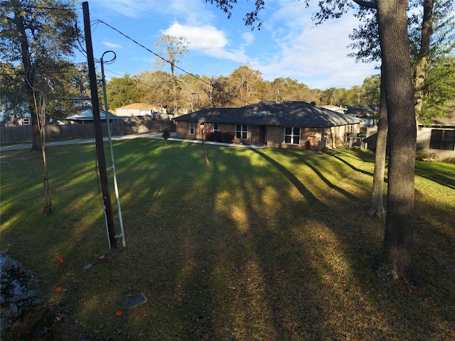 view of yard with fence