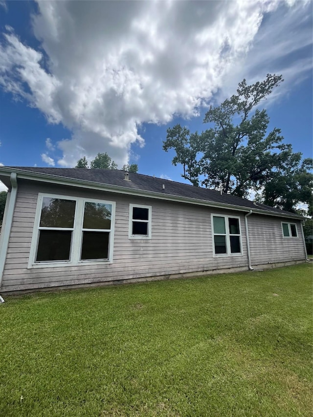 view of home's exterior featuring a lawn