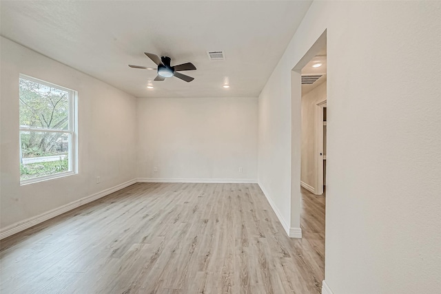 spare room with ceiling fan and light hardwood / wood-style floors