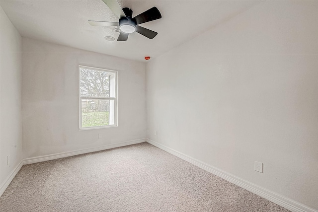 empty room with carpet and ceiling fan