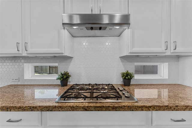 kitchen featuring white cabinetry, stainless steel gas cooktop, and extractor fan