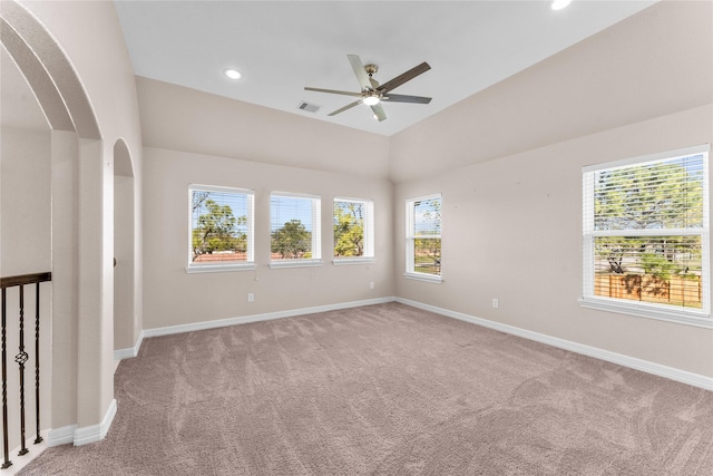 unfurnished room featuring lofted ceiling, light carpet, and ceiling fan