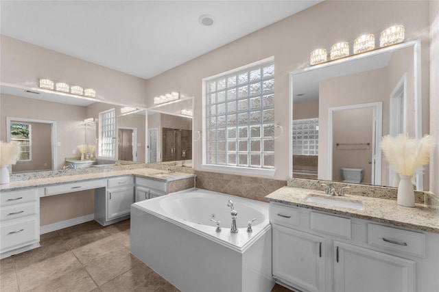 full bathroom with vanity, toilet, independent shower and bath, and tile patterned flooring