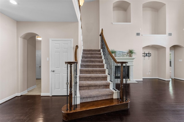 stairway with hardwood / wood-style floors