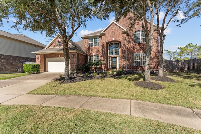 view of front property featuring a garage and a front lawn