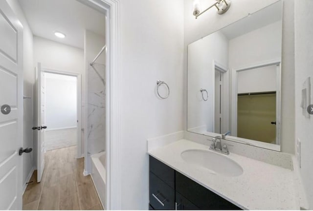 bathroom with shower / bathing tub combination and vanity