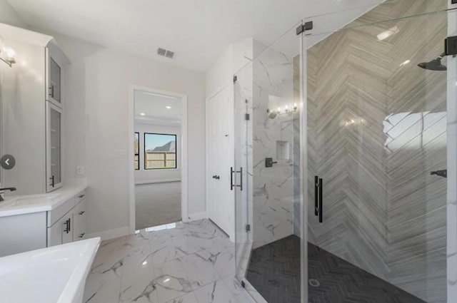 bathroom featuring vanity and a shower with door