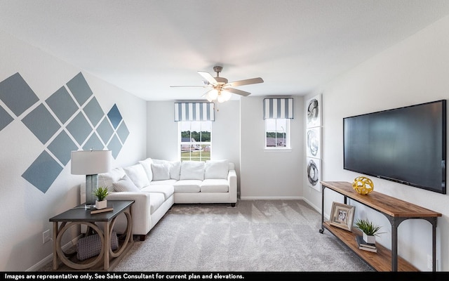 carpeted living room with ceiling fan