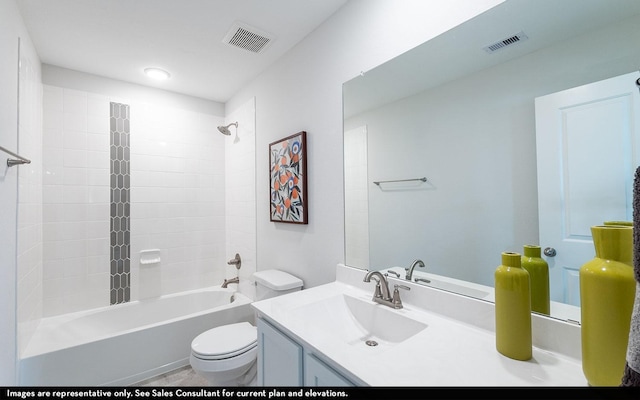 full bathroom featuring vanity, tiled shower / bath combo, and toilet