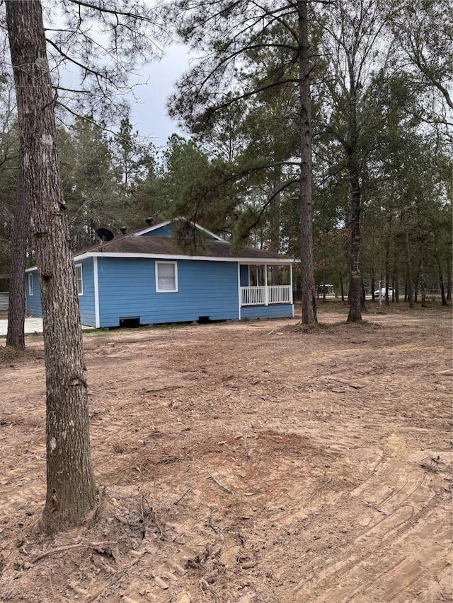 back of house with covered porch